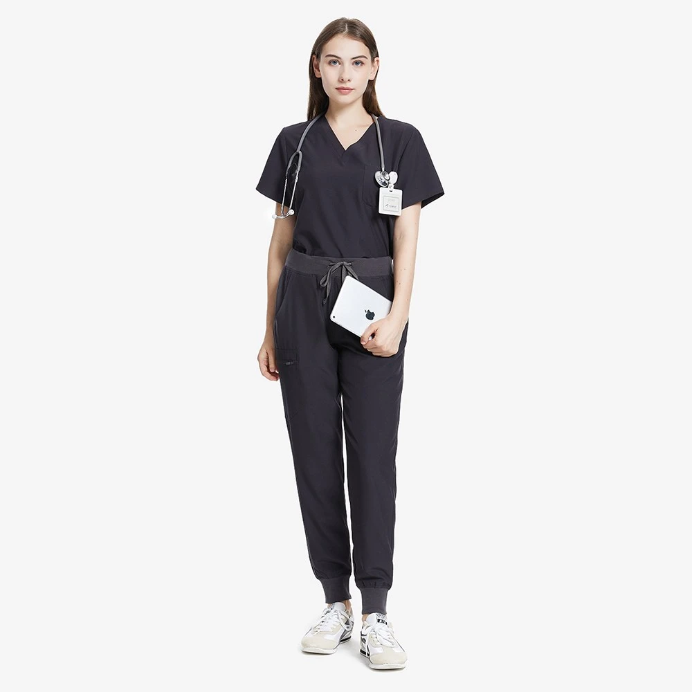 What Makes Dark Grey Scrubs Practical for Clinical Work?插图1 Valiant dark grey scrub set worn by a healthcare professional